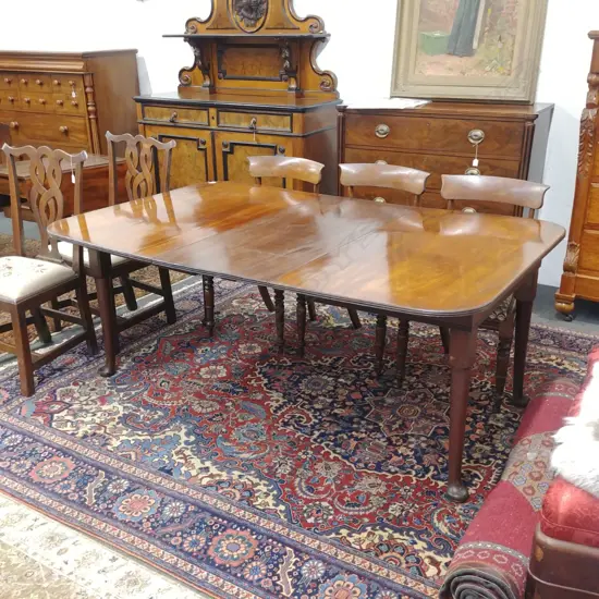 A late Georgian mahogany dining table