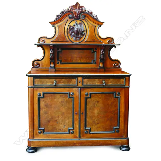 A decorative 19thC Continental walnut side cabinet with ebonised borders