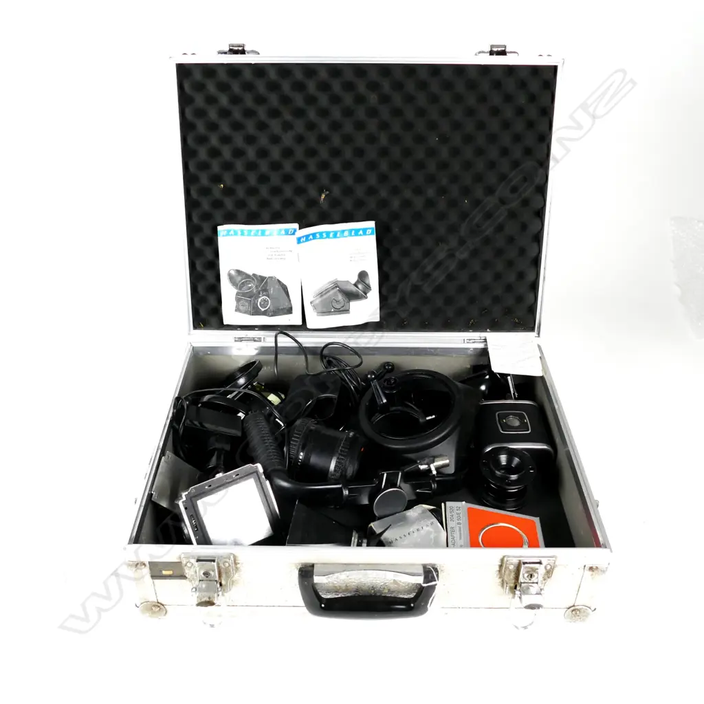 A large Linhof aluminium camera case containing assorted Hasselblad accessories Image 1++