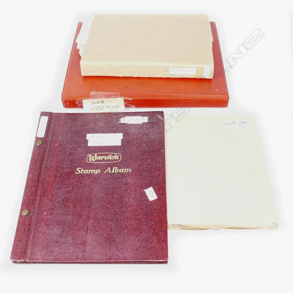 Four U.S.A stamp albums Image 1++