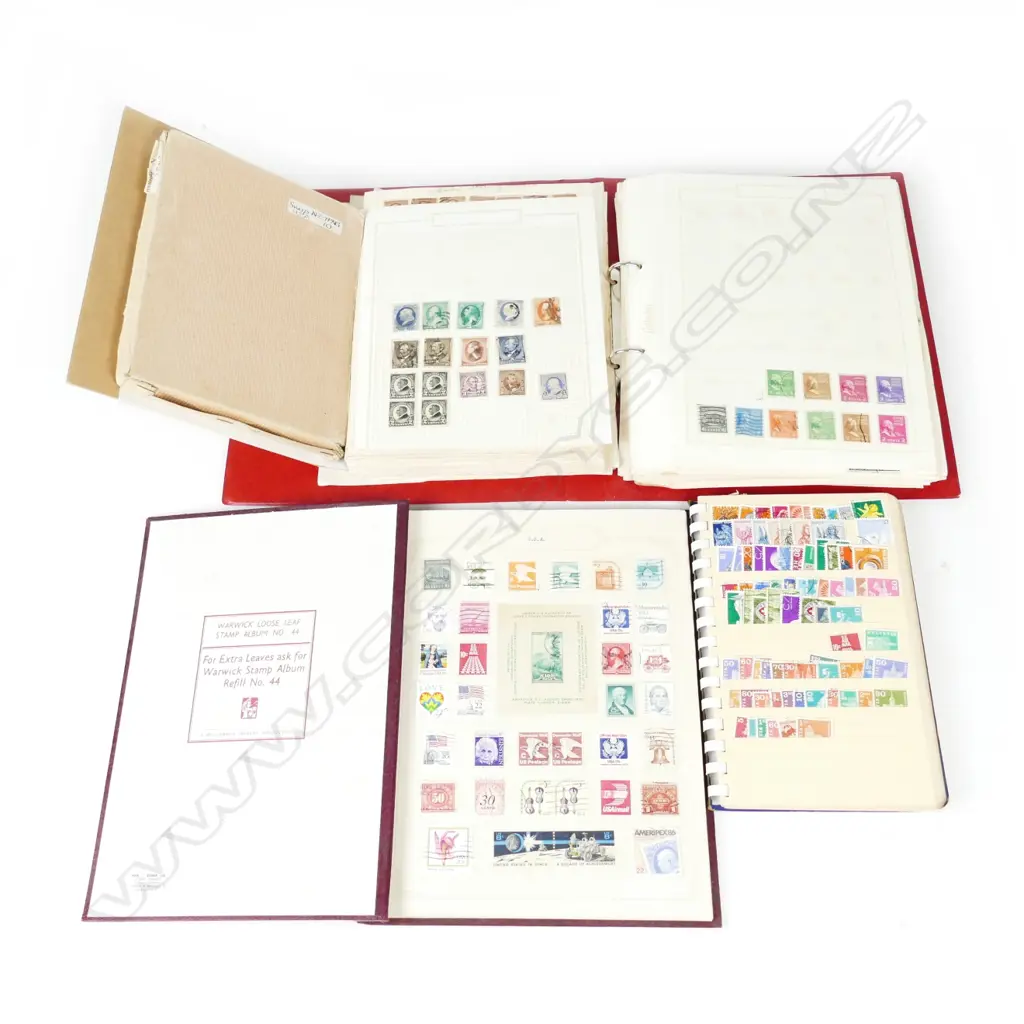 Four U.S.A stamp albums Image 1++