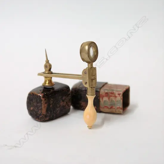 An early 19thC brass and ivory handled folding pocket map reader