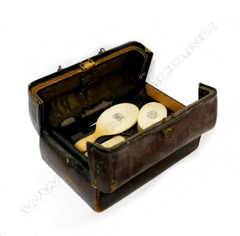 A Victorian Edwards & Sons gentleman's travelling valise with contents of ivory and ebony backed brushes Image 1++