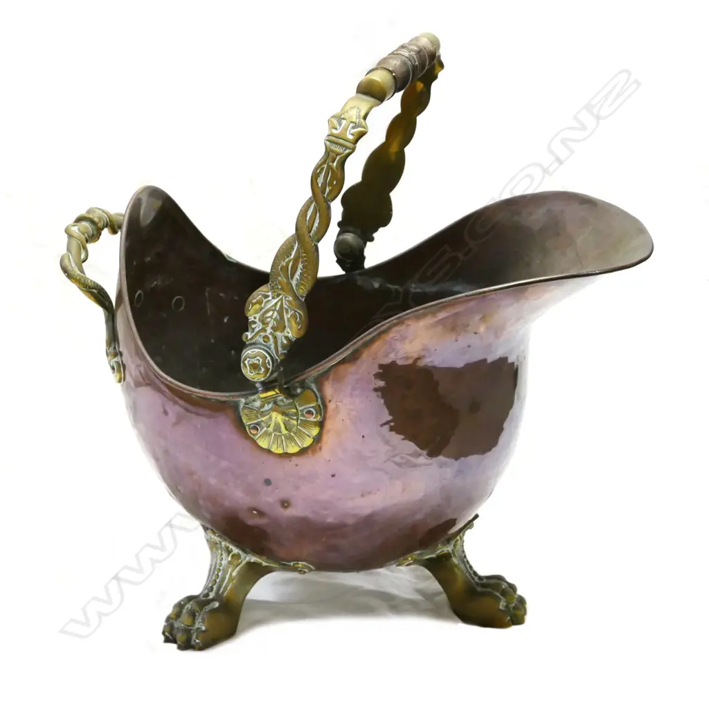 An ornate copper coal scuttle Image 1++