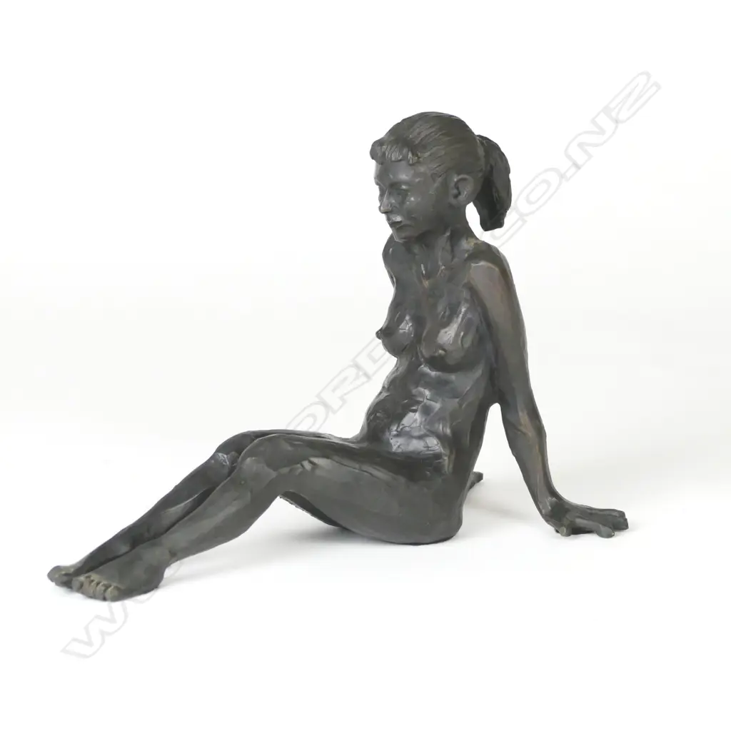 A bronze figure of a reclining young naked woman Image 1++