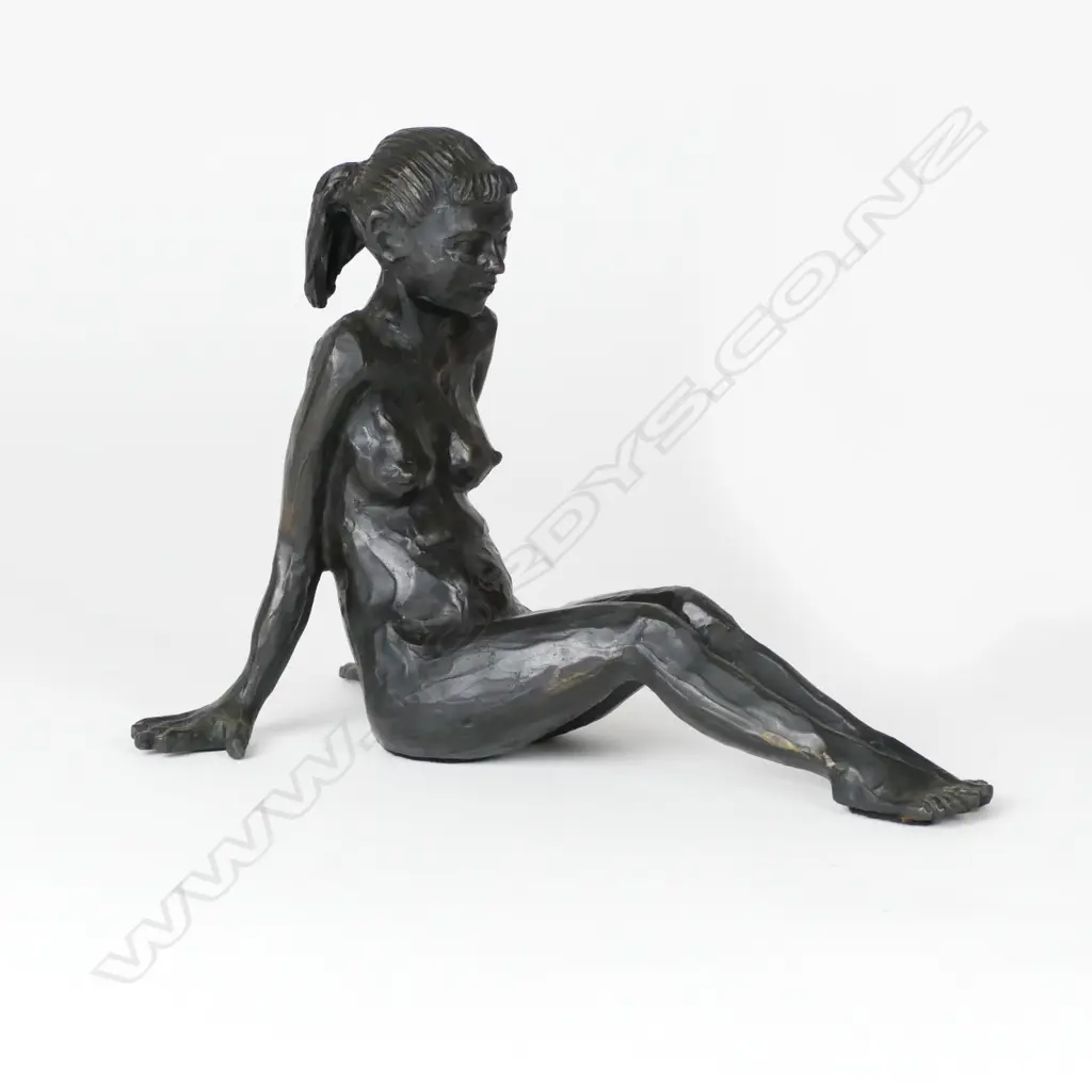 A bronze figure of a reclining young naked woman Image 1++