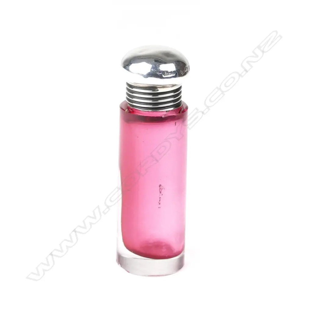 An Edwardian silver top and cranberry perfume bottle Image 1++