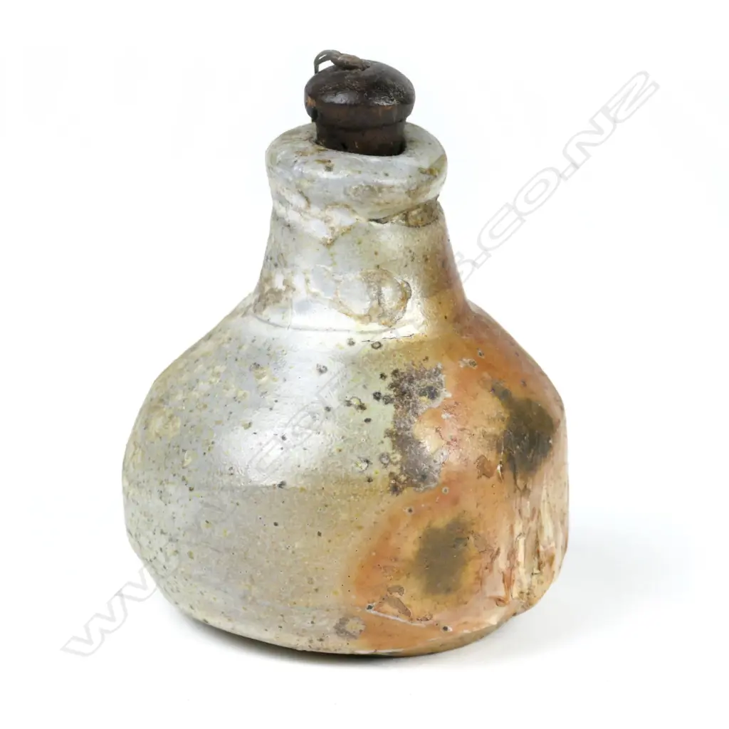 A good small Chester Nealie pottery flask of baluster shape with central lug and original cork stopper Image 1++
