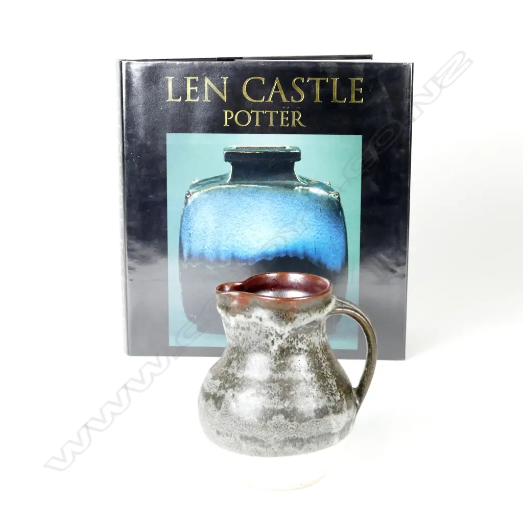 A Len Castle baluster jug with grey glazed effects. Impressed mark. H.150. Together with the book 'Len Castle Image 1++