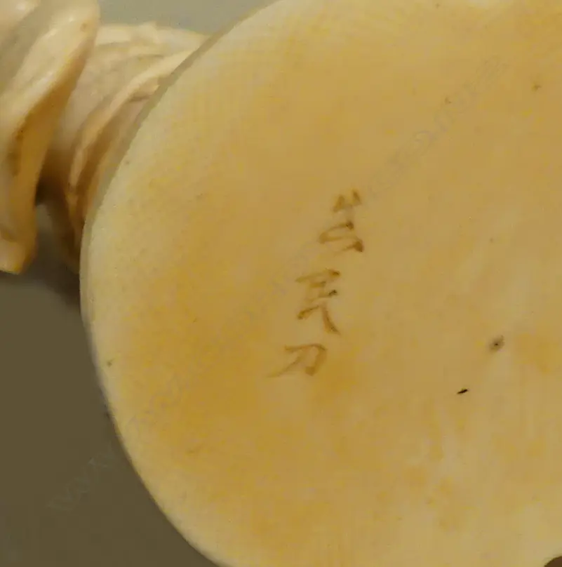 A Japanese Meiji carved ivory okimono of a geisha Image 1++