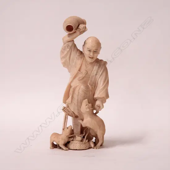 A Japanese Meiji finely carved ivory characterful figure of a fisherman