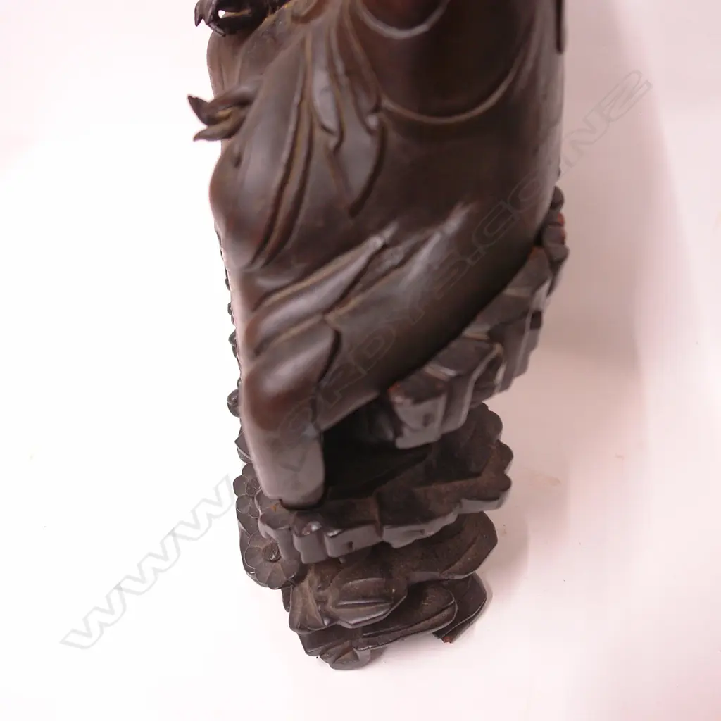 An 19thC or earlier Chinese bronze seated monk on carved wooden stand Image 1++