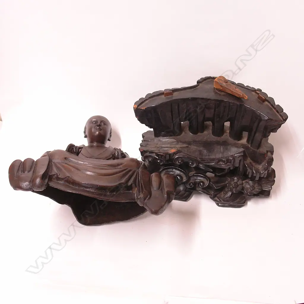 An 19thC or earlier Chinese bronze seated monk on carved wooden stand Image 1++