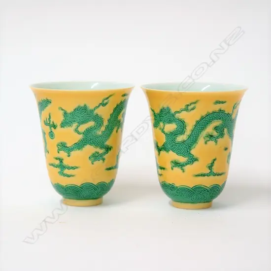 A quality pair of Imperial yellow and green porcelain wine cups