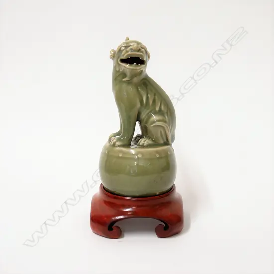 An old celadon seated Kylin