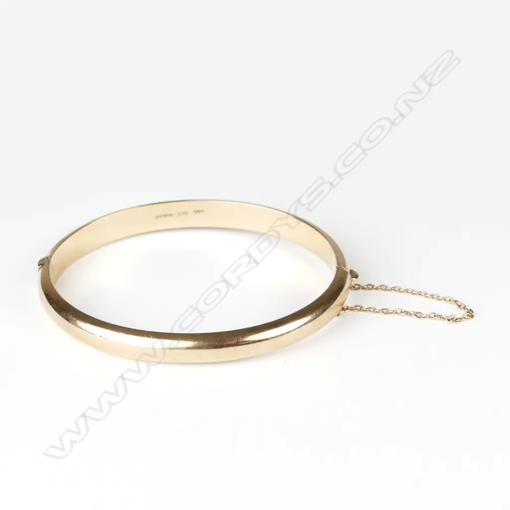 A lady's half-hinged 9ct. rose gold bangle Image 1++