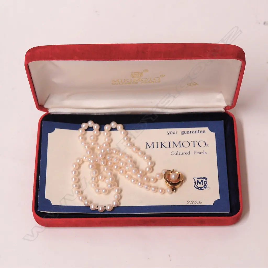 A vintage string of Japanese Mikimoto cultured pearls Image 1++
