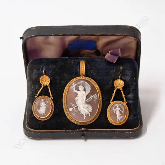 An impressive quality 15ct. yellow gold and finely carved cameo boxed pendant/brooch and earring suite