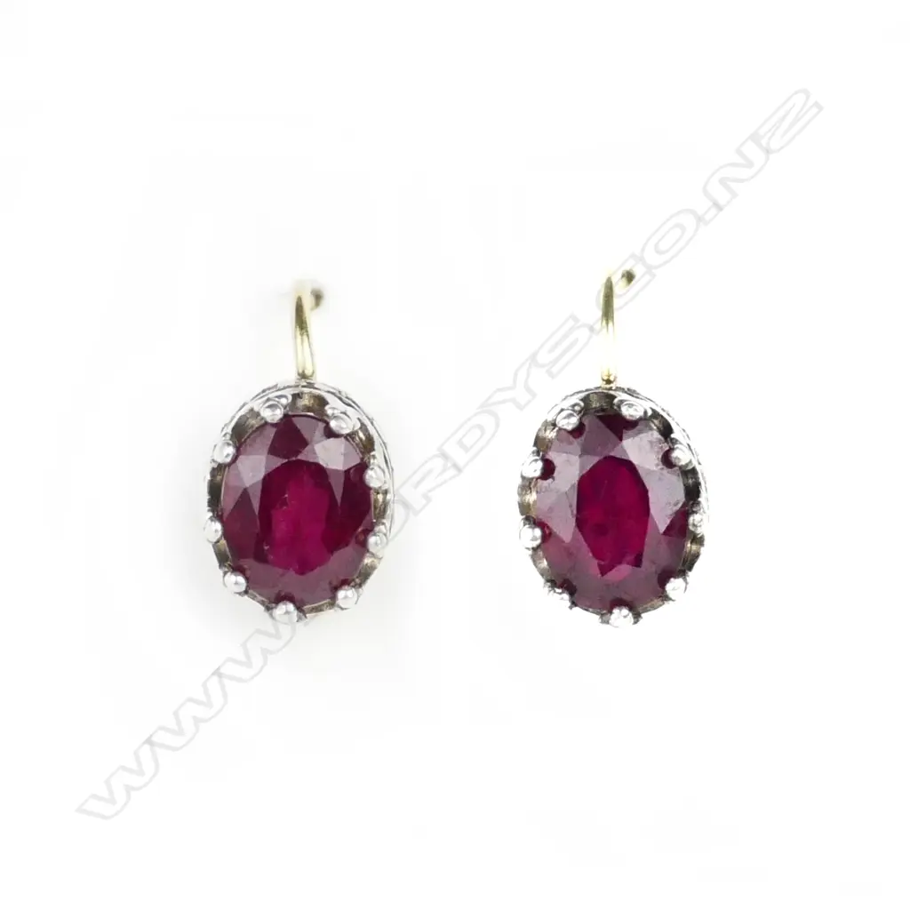 A pair of 18ct. white and yellow gold ruby earrings Image 1++