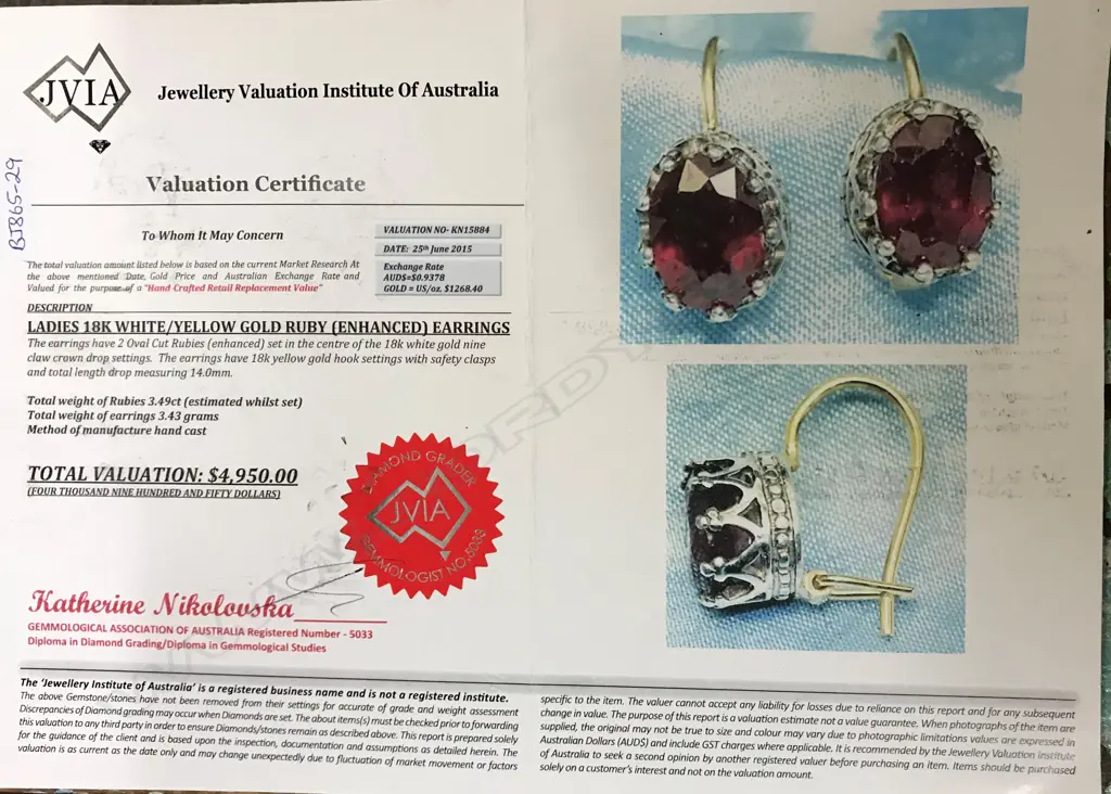 A pair of 18ct. white and yellow gold ruby earrings Image 1++