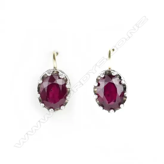 A pair of 18ct. white and yellow gold ruby earrings