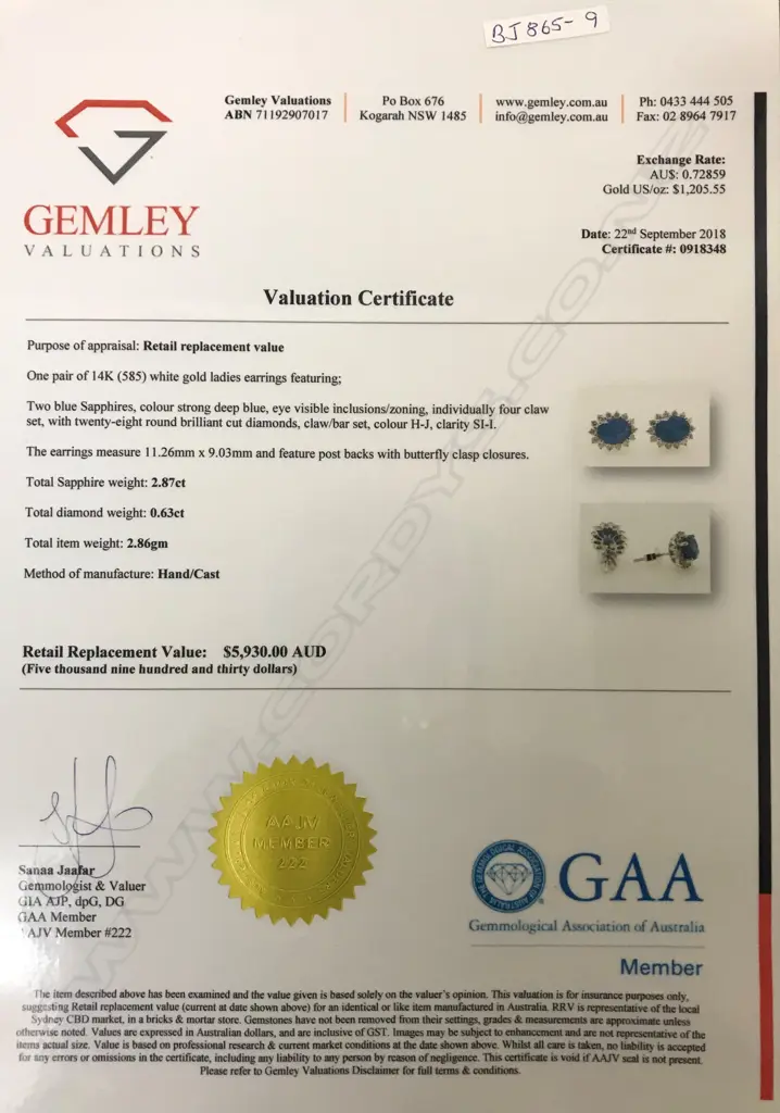 A pair of 14ct. white gold sapphire and diamond stud earrings Image 1++