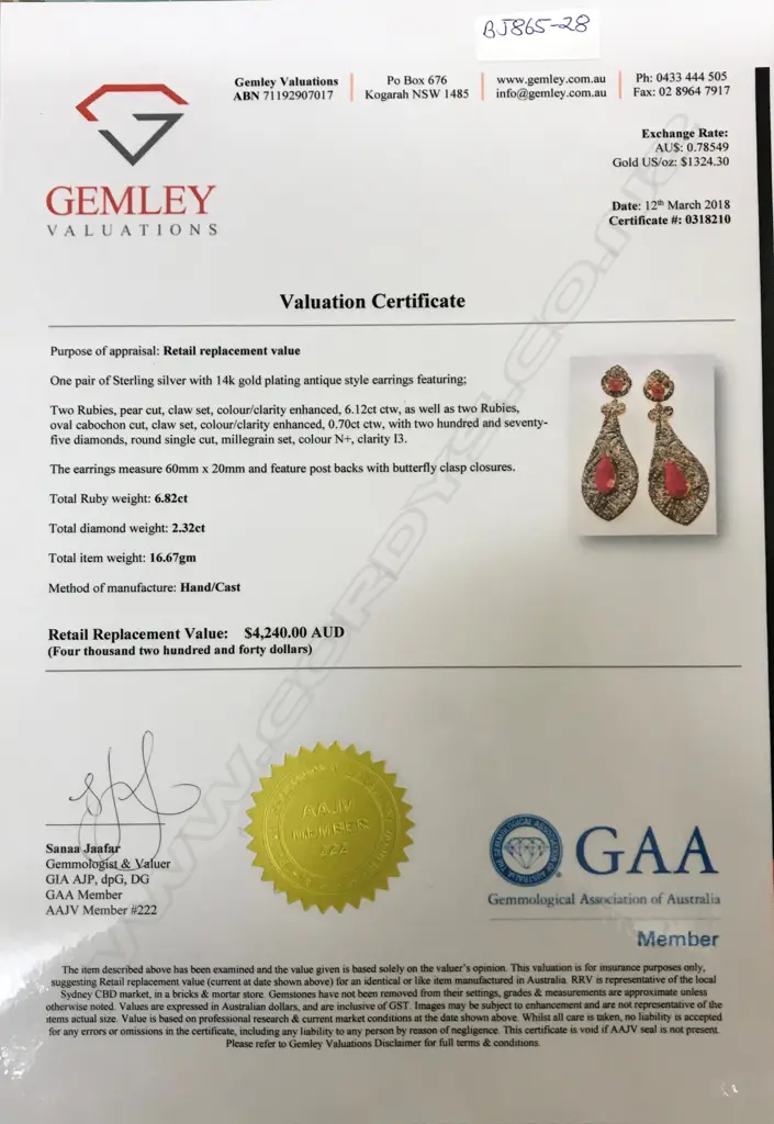 A pair of 14ct. and silver ruby and diamond drop earrings Image 1++