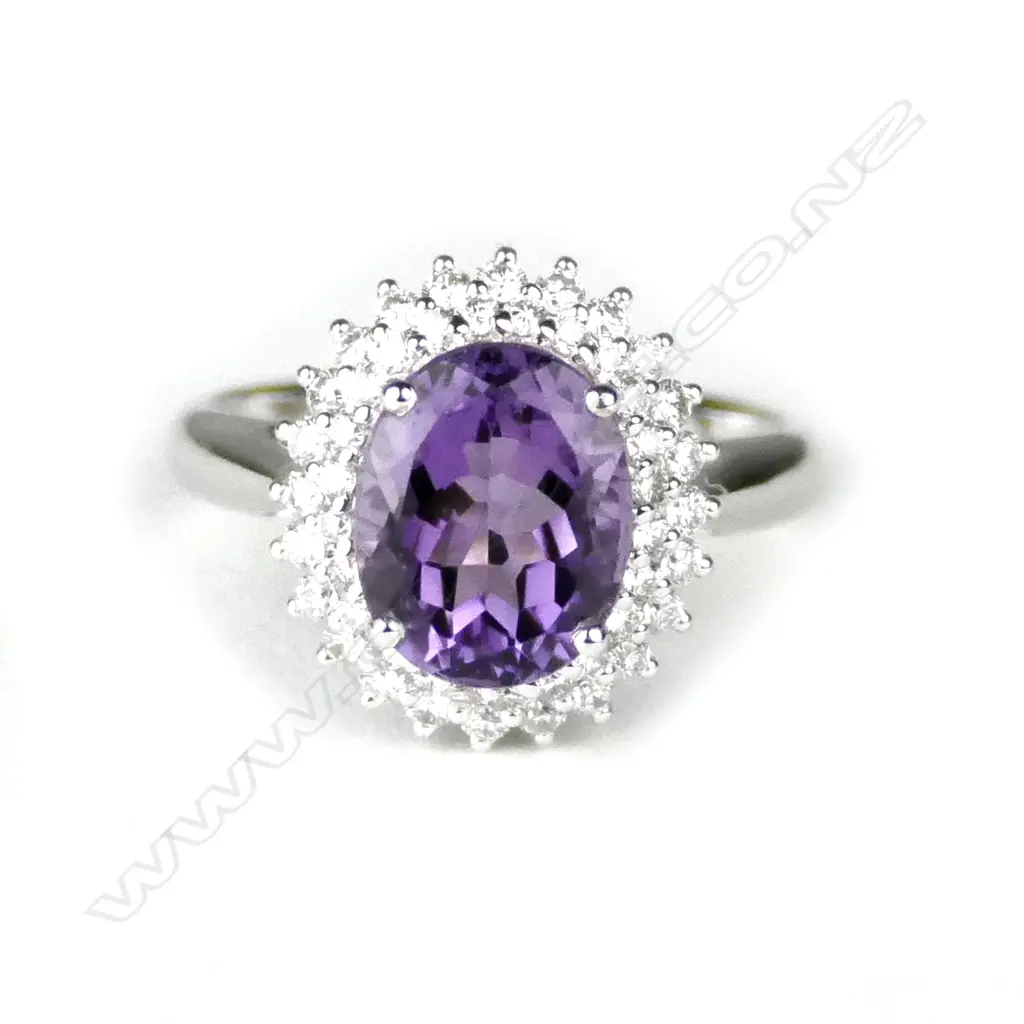 A lady's modern 18ct. white gold amethyst and diamond cluster ring Image 1++