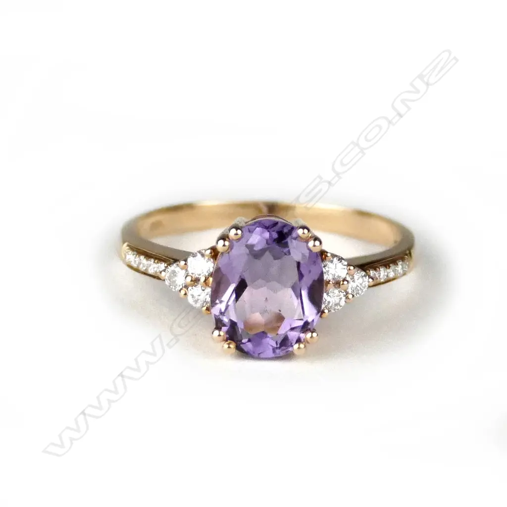 A lady's modern 18ct. rose gold amethyst and diamond ring Image 1++