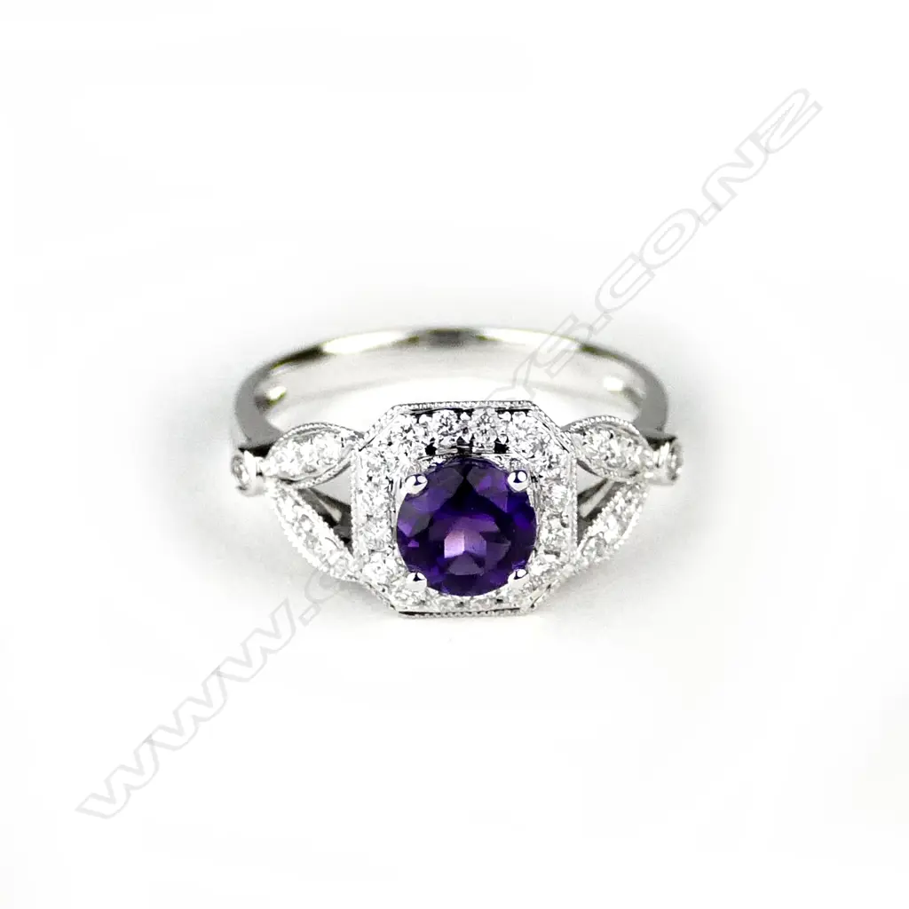 An 18ct. white gold amethyst and diamond dress ring Image 1++