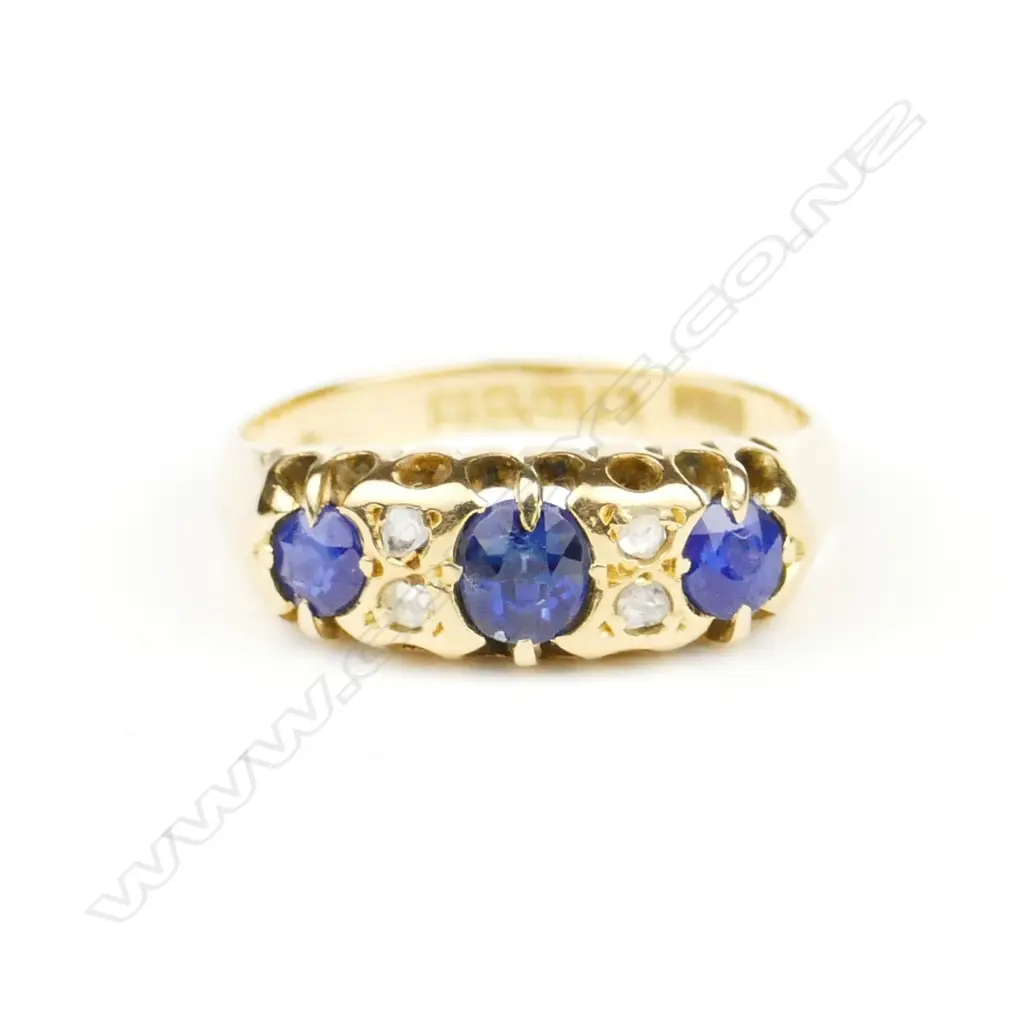 An English made 1919 lady's 18ct. yellow gold sapphire and diamond London bridge style ring Image 1++