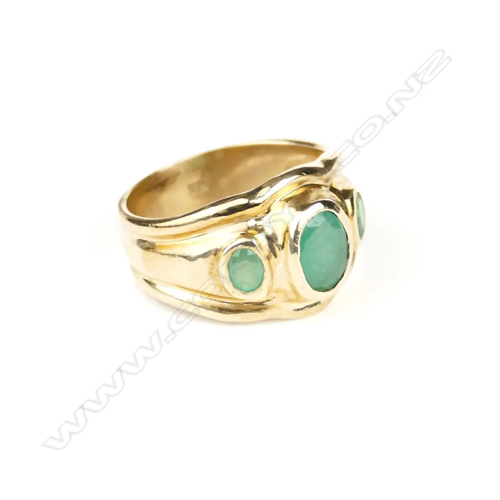 A handmade 9ct. yellow gold and three emerald ring Image 1++