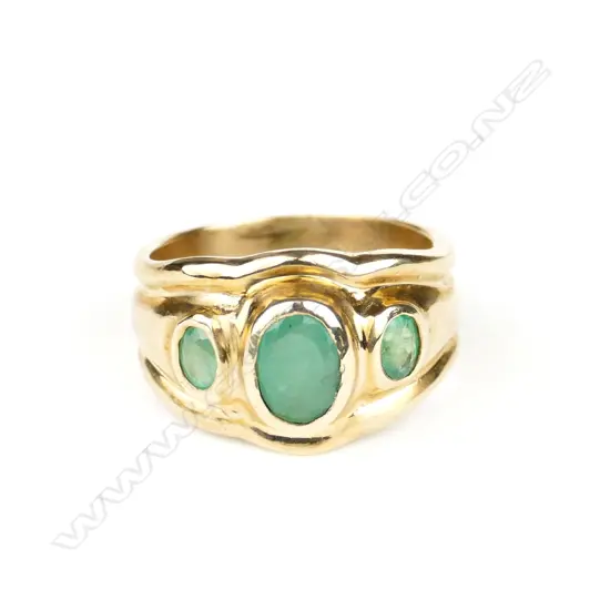 A handmade 9ct. yellow gold and three emerald ring