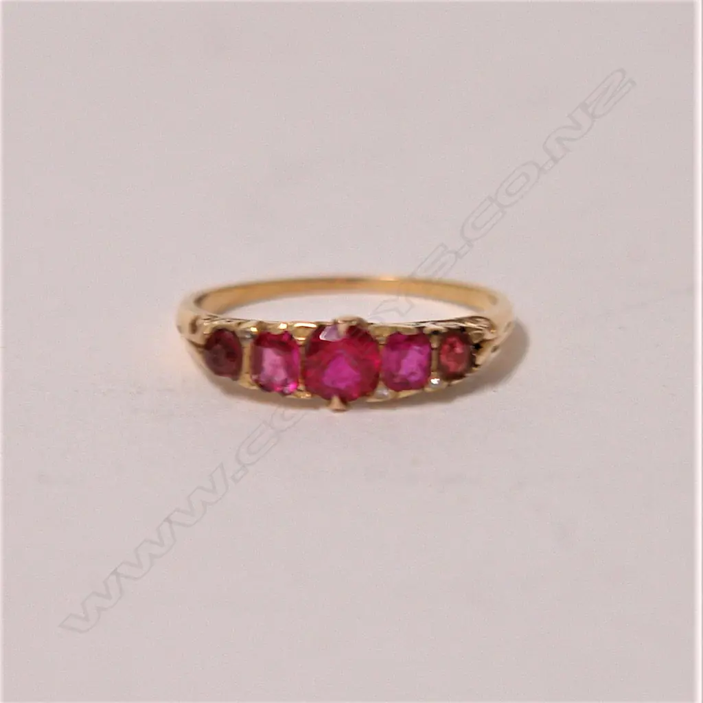 A c.1900 18ct. yellow gold and ruby bridge type ring Image 1++