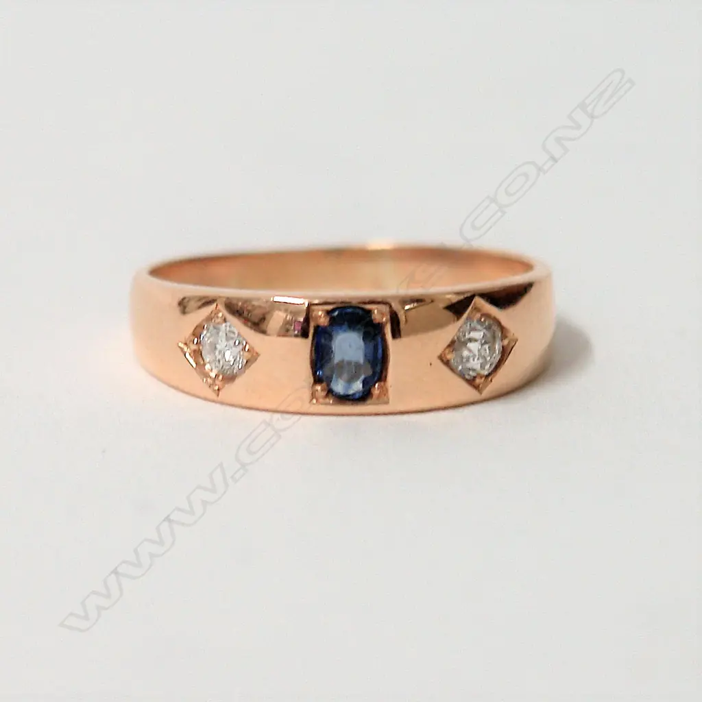 An 18ct. yellow gold sapphire and diamond gypsy style ring Image 1++