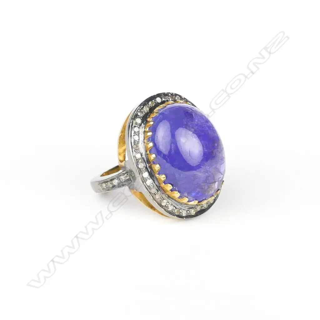 An impressive 14ct. yellow gold and silver tanzanite and diamond dress ring Image 1++
