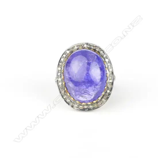 An impressive 14ct. yellow gold and silver tanzanite and diamond dress ring
