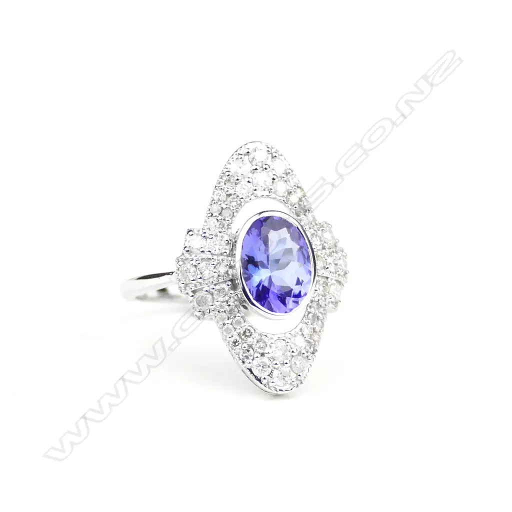An 18ct white gold tanzanite and diamond ring Image 1++