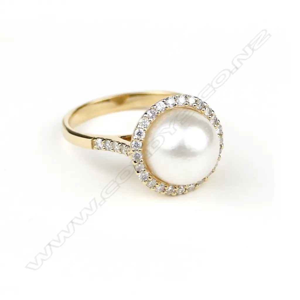 A 14ct. gold pearl and diamond ring Image 1++