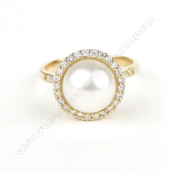 A 14ct. gold pearl and diamond ring