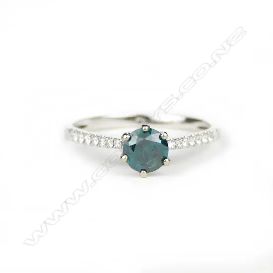 A 14ct. white gold and diamond ring