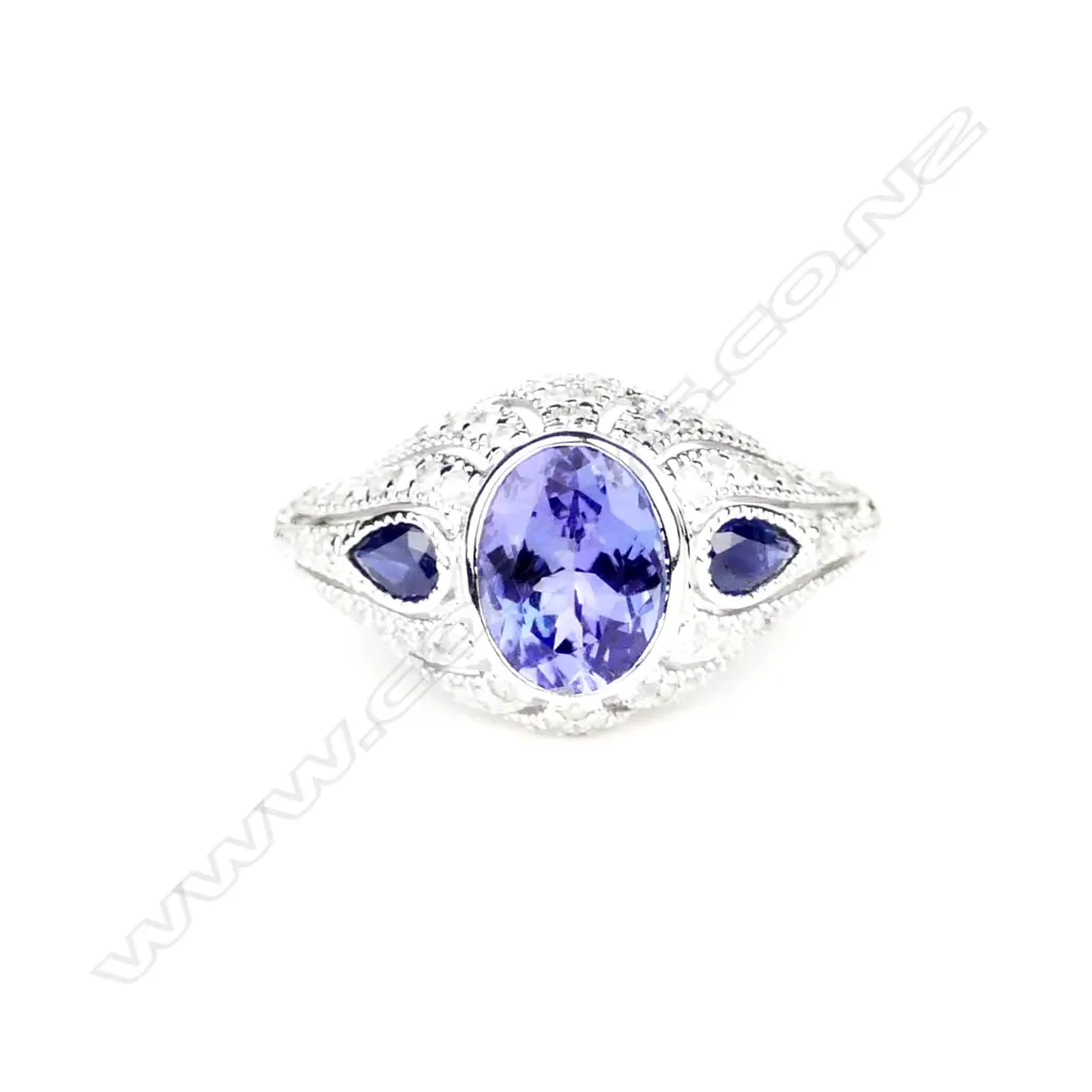 An 18ct. white gold tanzanite sapphire and diamond Art Deco style ring Image 1++