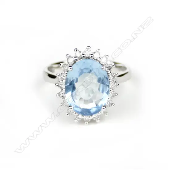 A 14ct. white gold aquamarine and diamond ring