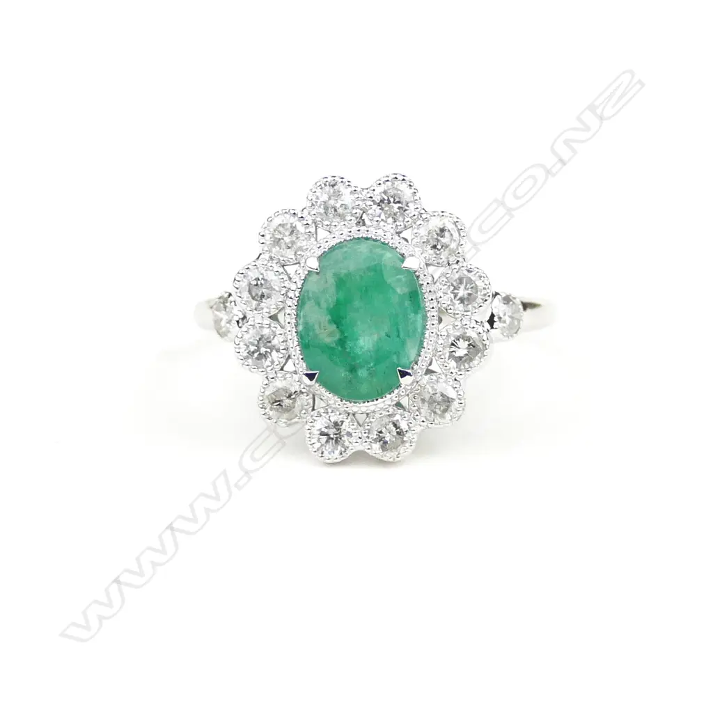 An 18ct. white gold emerald and diamond ring Image 1++