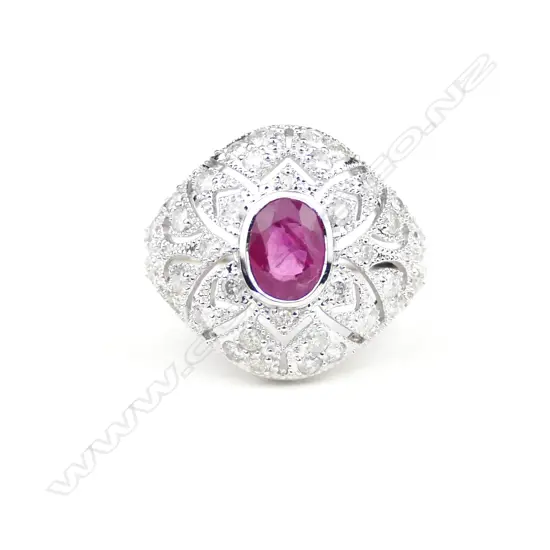 An 18ct. white gold ruby and diamond Art Deco style ring