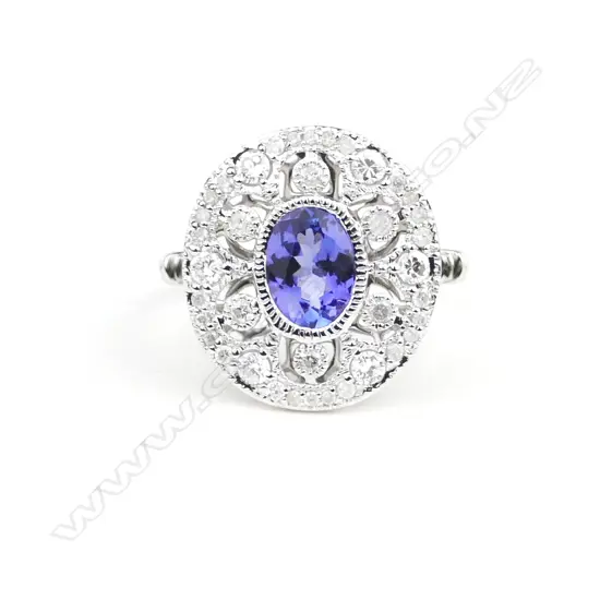 An 18ct. white gold tanzanite and diamond Art Deco style ring