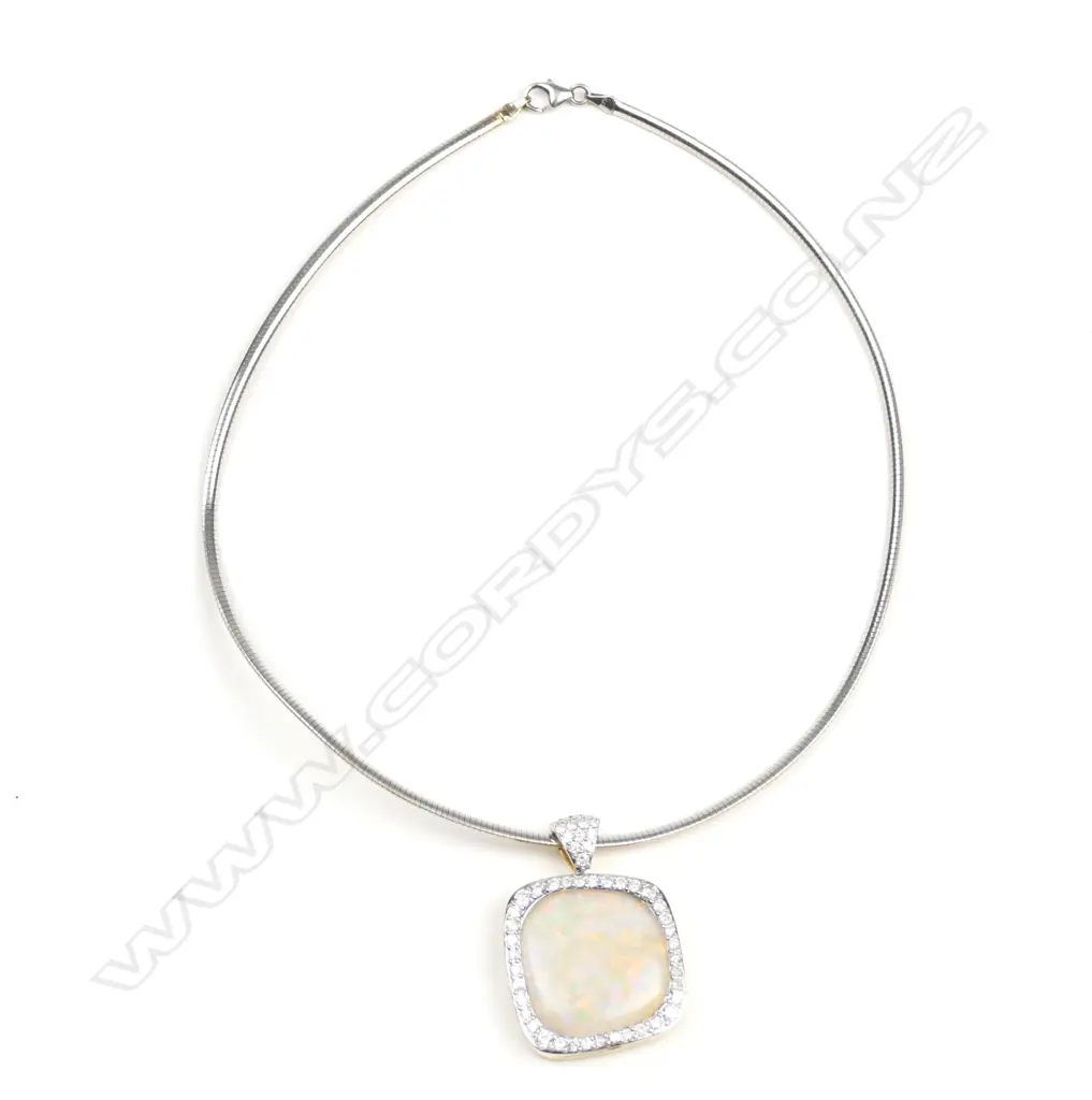 An 18ct. yellow and white gold opal and diamond pendant Image 1++