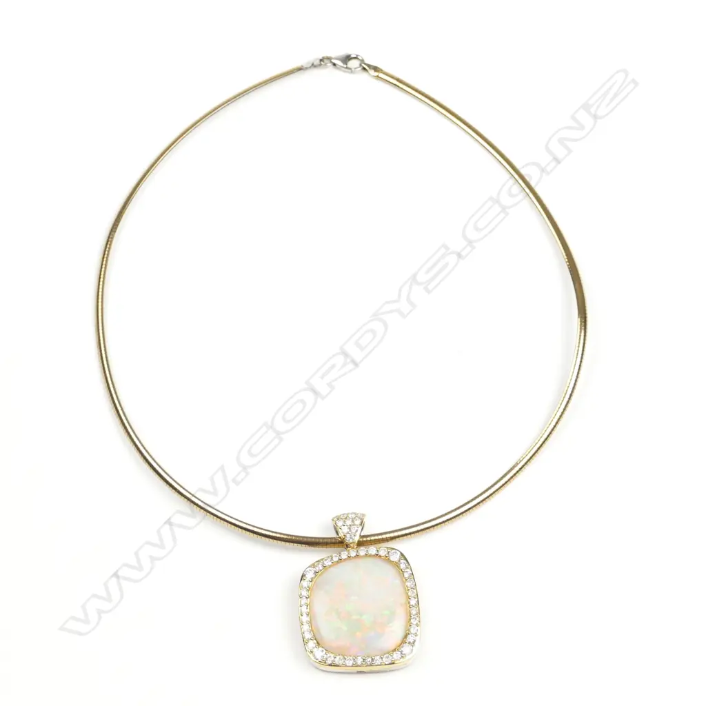 An 18ct. yellow and white gold opal and diamond pendant Image 1++