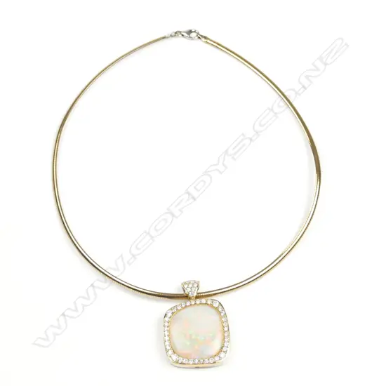 An 18ct. yellow and white gold opal and diamond pendant