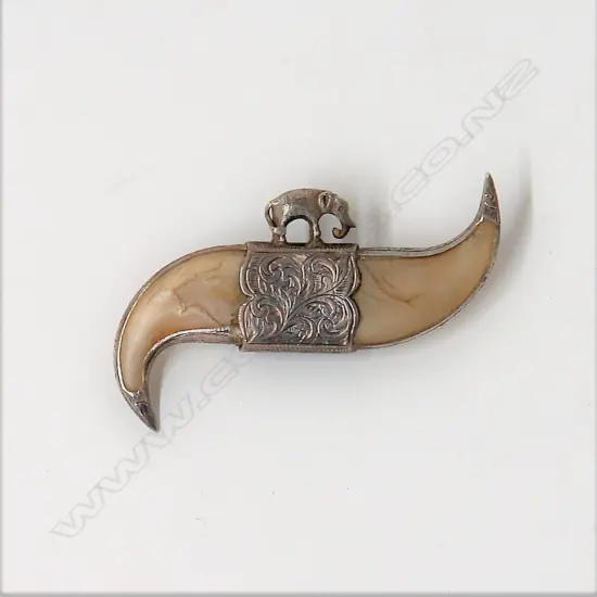A late 19thC silver mounted Indian double tiger's claw brooch